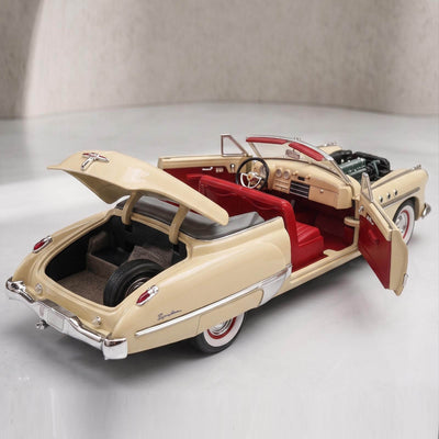 1949 Buick Roadmaster - Beige model car with red interior, open doors, trunk, and visible detailed engine, showcasing classic vintage design, offered Up To 75% Off Retail.