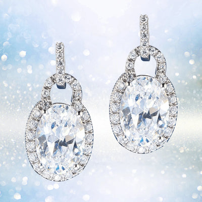 Oval Padlock Earrings crafted in sterling silver, featuring sparkling oval-shaped stones surrounded by a halo of smaller crystals for an elegant feminine jewelry look.