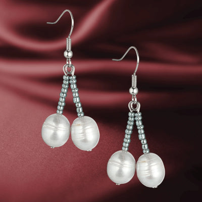 Dove Silver Pearl Earrings featuring delicate silver beads and elegant pearl drops designed for a refined feminine jewelry collection.