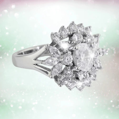 Cluster Ring featuring a sterling silver band adorned with multiple sparkling clear stones arranged in an elegant floral cluster design for women’s jewelry.