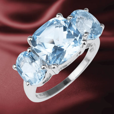 Sky Topaz Ring featuring three sparkling sky blue topaz gemstones set in polished sterling silver, designed for women with an elegant and timeless style.