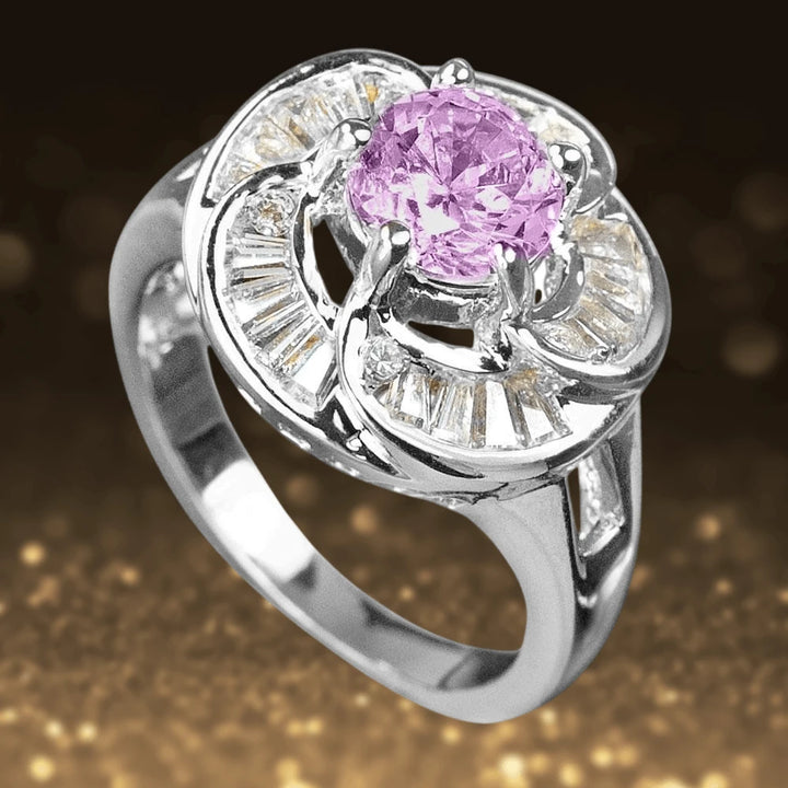 Rose Ring featuring a sterling silver band with rhodium plating, showcasing a central pink gemstone surrounded by delicate clear stones in an elegant floral-inspired design for women’s jewelry.