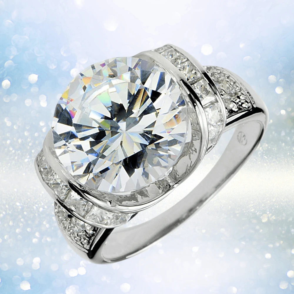 Ultima Ring featuring a large round-cut center stone set in sterling silver with rhodium plating, designed for women, showcasing a modern and elegant jewelry style.