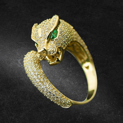 Panther Ring in sterling silver with gold plating, featuring a detailed panther head design encrusted with small crystals and green gemstone eyes, designed for women.
