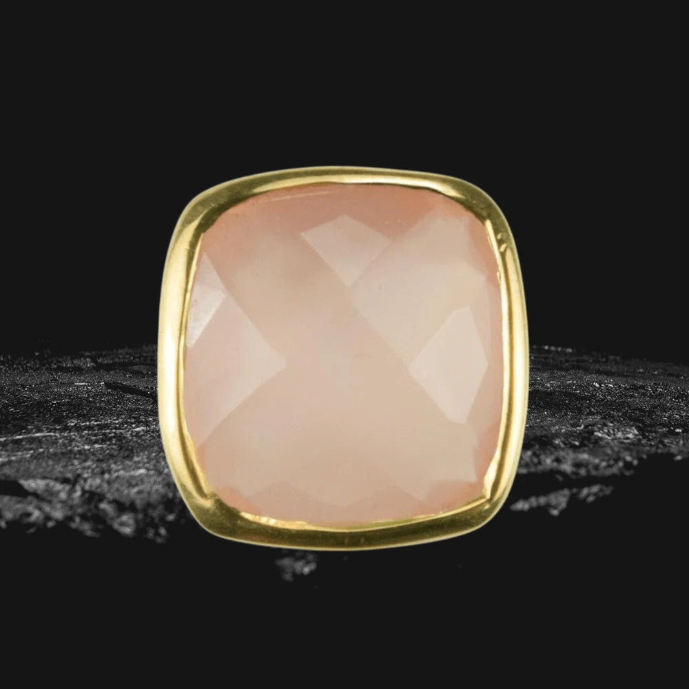 Close-up of Dream Gems Earrings Pink Quartz featuring a polished pink quartz stone set in sterling silver with elegant gold plating, designed for women’s jewelry.