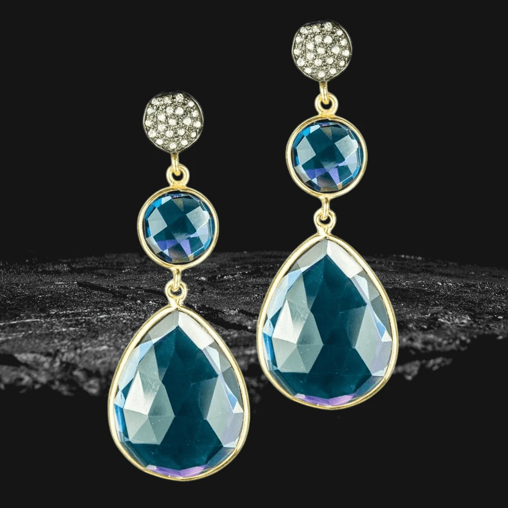 Elegant Midnight Blue Dangle Earrings featuring two-tone sterling silver with faceted blue stones and sparkling crystal accents, designed for female jewelry enthusiasts.