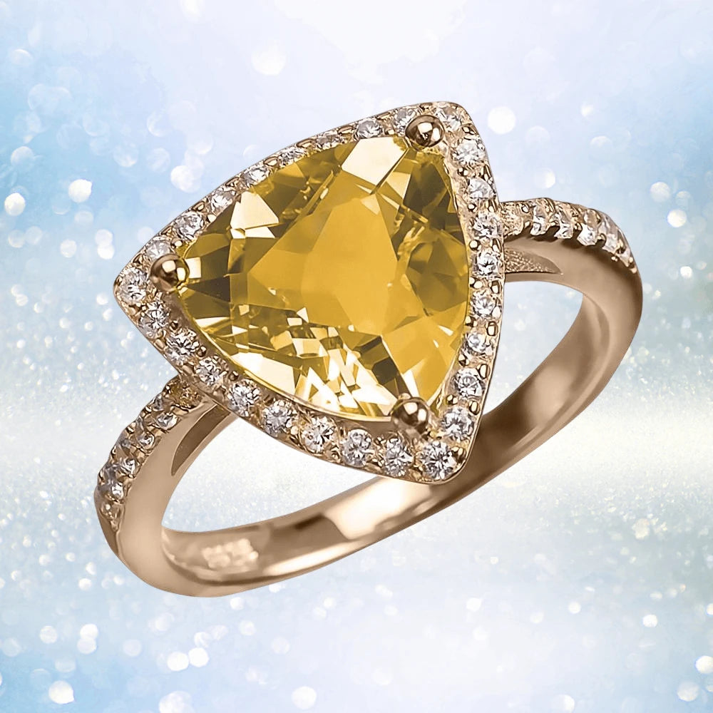 Citrine Sun Ring featuring a triangular citrine gemstone set in a sterling silver band plated with gold, adorned with small sparkling stones, designed for female wearers.