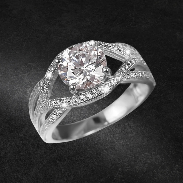 Astor Ring featuring a sparkling round center stone set in rhodium-plated sterling silver with intricate detailing, designed for women’s fine jewelry collection.