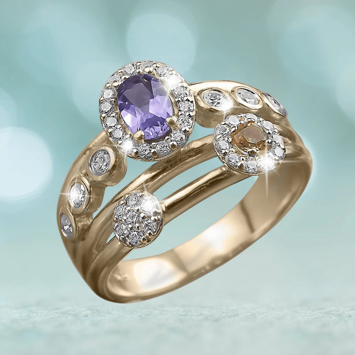 Constellation Ring made of sterling silver with gold plating, featuring an oval purple gemstone surrounded by small clear crystals on a female jewelry ring design.