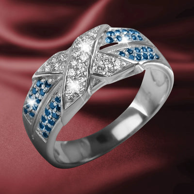 Embrace Rhodium Ring featuring sterling silver with rhodium plating, adorned with sparkling clear and blue gemstones, designed elegantly for women’s jewelry collections.