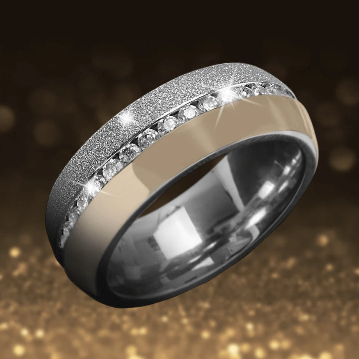 Santo Ring featuring a unisex design crafted from stainless steel with gold plating and a row of sparkling clear gemstones for elegant jewelry lovers.