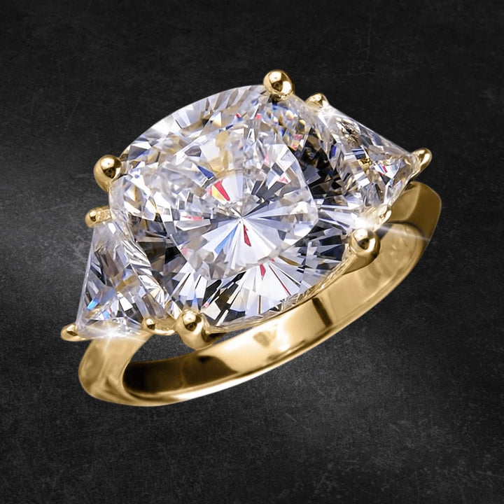 Infinity Ring featuring a large, sparkling center stone with two trapezoid-cut side stones set in sterling silver with gold plating, designed for female jewelry enthusiasts.