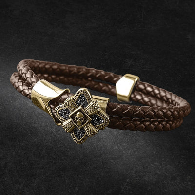 Men's Midnight Skull Gold Fused Bracelet featuring braided brown leather and stainless steel accents with gold plating, designed for men’s jewelry collections.