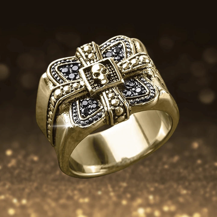 Midnight Skull Gold Fused Ring featuring a bold gold-plated stainless steel design with intricate skull and cross detailing, crafted for men’s jewelry collections.