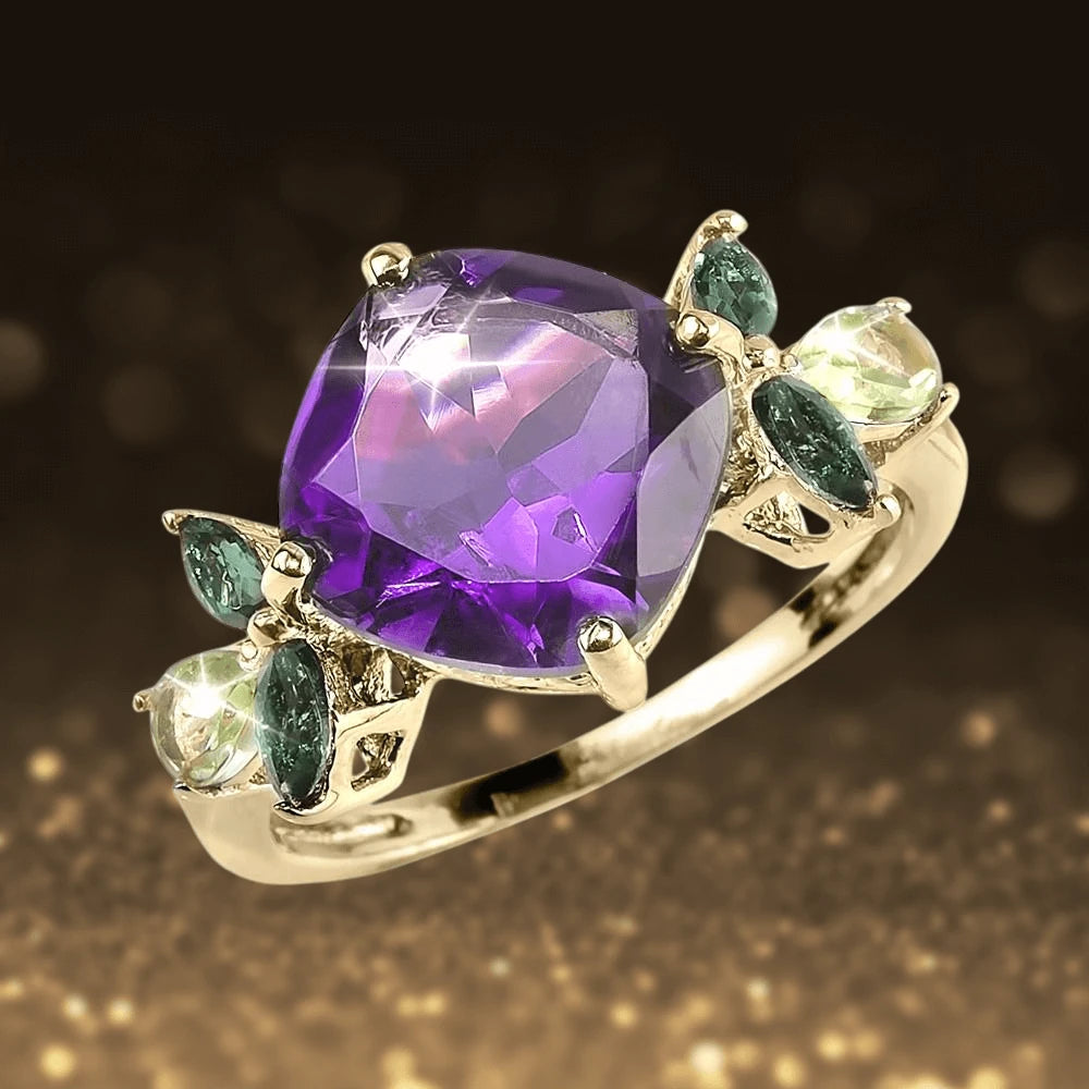 Violetta Ring featuring a large purple gemstone centerpiece, accented by smaller green and clear stones, set in gold-plated sterling silver for female jewelry.