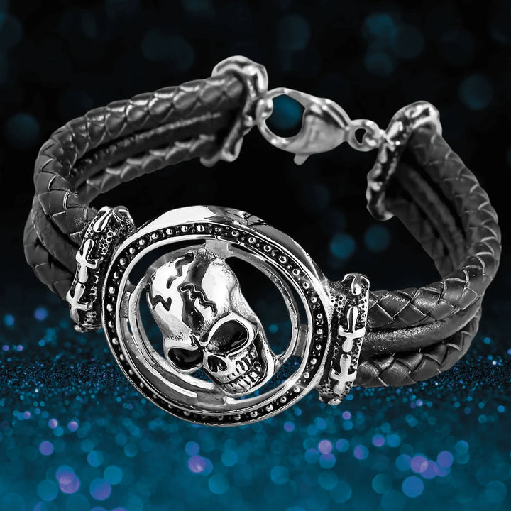 Skull Arena Steel Bracelet featuring a stainless steel skull centerpiece on a braided black band designed for male jewelry collectors and enthusiasts.