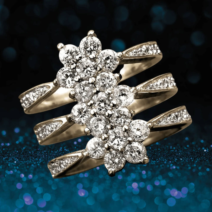 Close-up of a Sterling Silver Flower Journey Yellow Gold Ring for female with gold plating, showcasing a floral cluster design adorned with sparkling clear stones on a glittering dark blue background.