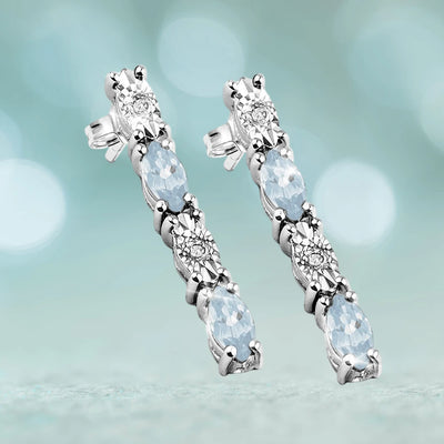 Navette Topaz Earrings crafted in sterling silver with rhodium plating, featuring alternating topaz and sparkling clear stones for an elegant female jewelry statement.