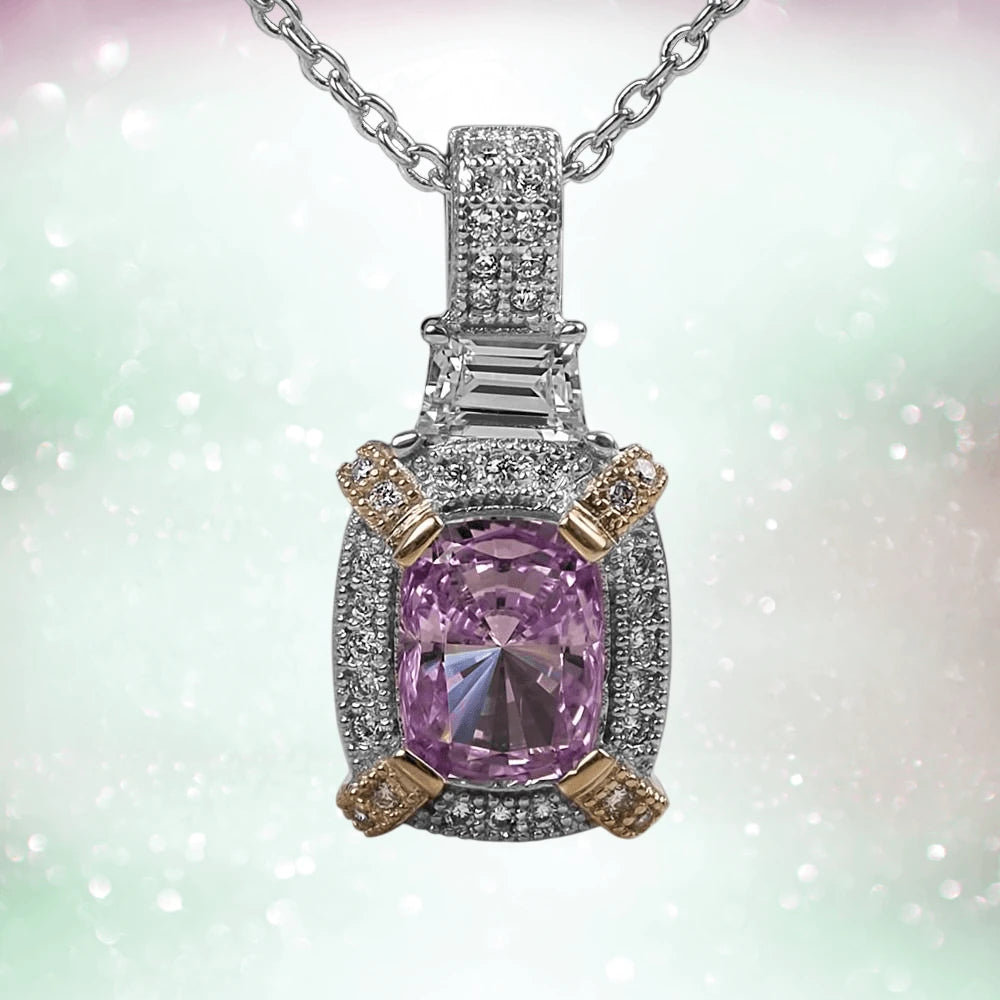 Dahlia Blossom Pendant featuring a two-tone sterling silver setting with a central pink gemstone surrounded by sparkling accents on a delicate chain.