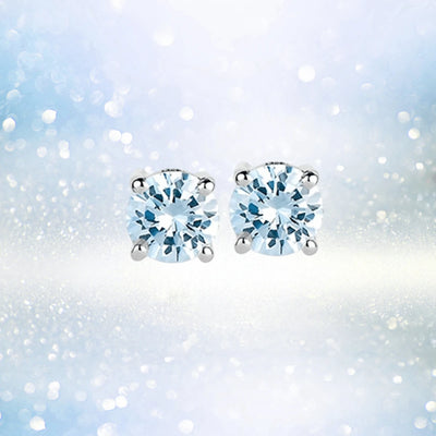 Brilliant Birthstones Earrings March featuring round aquamarine gemstones set in sterling silver with rhodium plating, designed for a refined female jewelry collection.