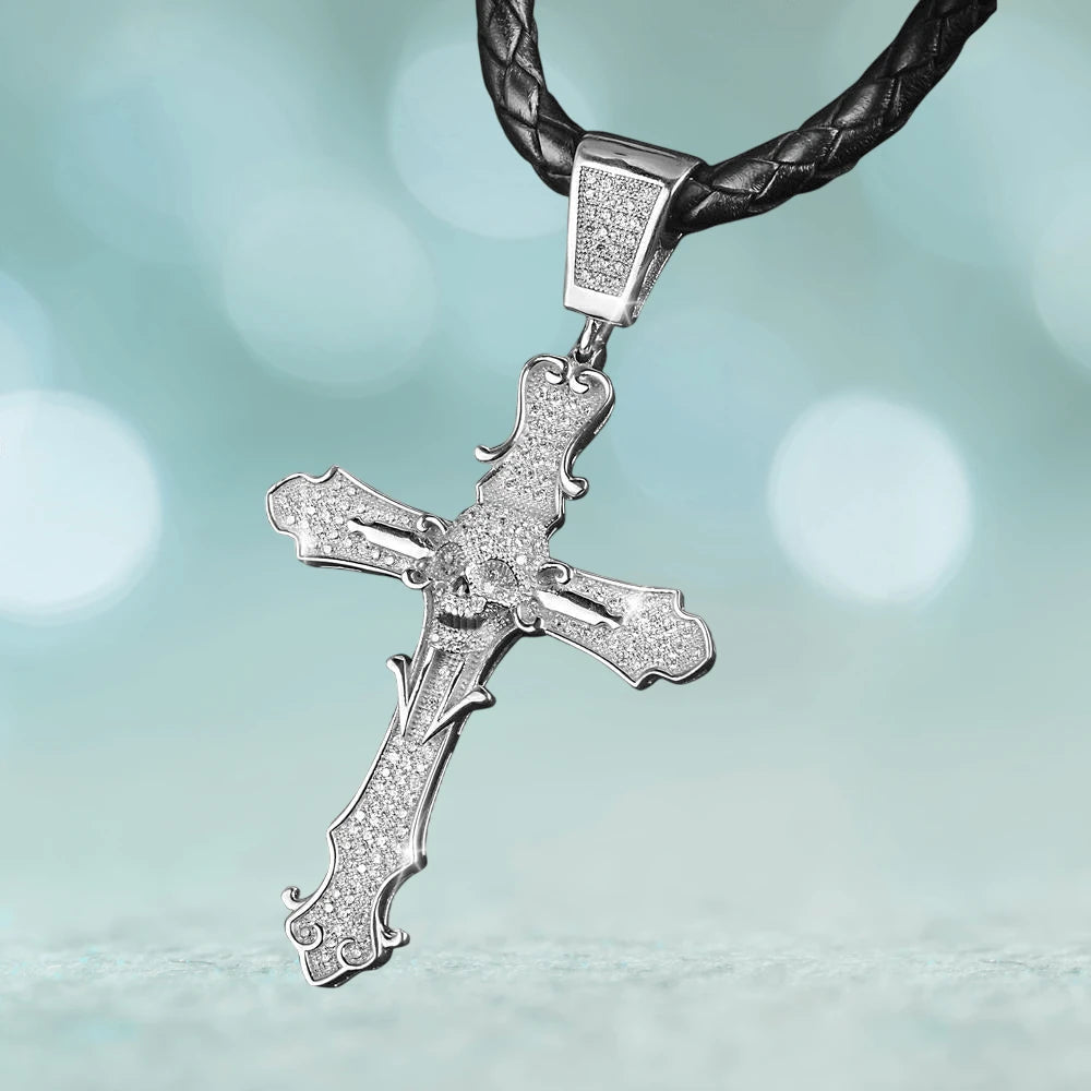 Skull Cross Rhodium Pendant made of sterling silver with rhodium plating, featuring a detailed skull design on a cross, hanging from a black braided leather necklace, masculine jewelry piece.