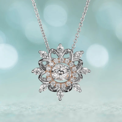 Dancing Snowflake Pendant featuring a two-tone sterling silver design with intricate crystal accents, elegantly crafted for women’s jewelry collections.