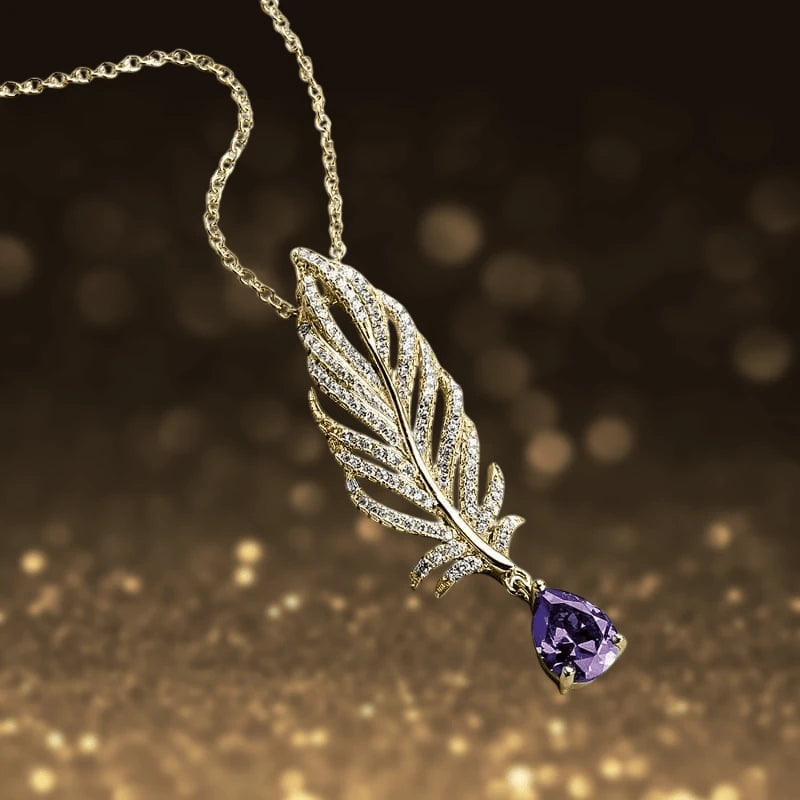 Orelia Amethyst Pendant featuring a rhodium-plated feather design adorned with sparkling stones and a teardrop-shaped amethyst, elegant jewelry for women.