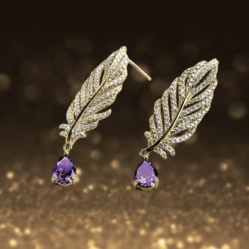 Orelia Amethyst Earrings featuring sterling silver with rhodium plating, designed for women, showcasing leaf-shaped studs adorned with sparkling accents and teardrop amethyst gemstones.