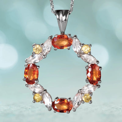 Champagne Sapphire Pendant featuring sterling silver with rhodium plating, adorned with vibrant orange, clear, and yellow gemstones in an elegant circular design for women’s jewelry.
