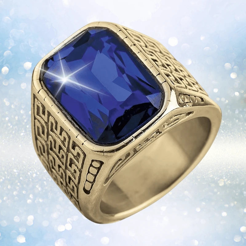 Blue Knight Ring featuring a large rectangular blue stone set in gold-plated stainless steel with intricate geometric engravings, designed for men’s jewelry collections.