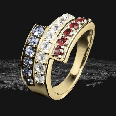 Stripes Ring in gold-plated sterling silver featuring three rows of multicolored gemstones including blue, clear, and red, designed for women’s jewelry collections.