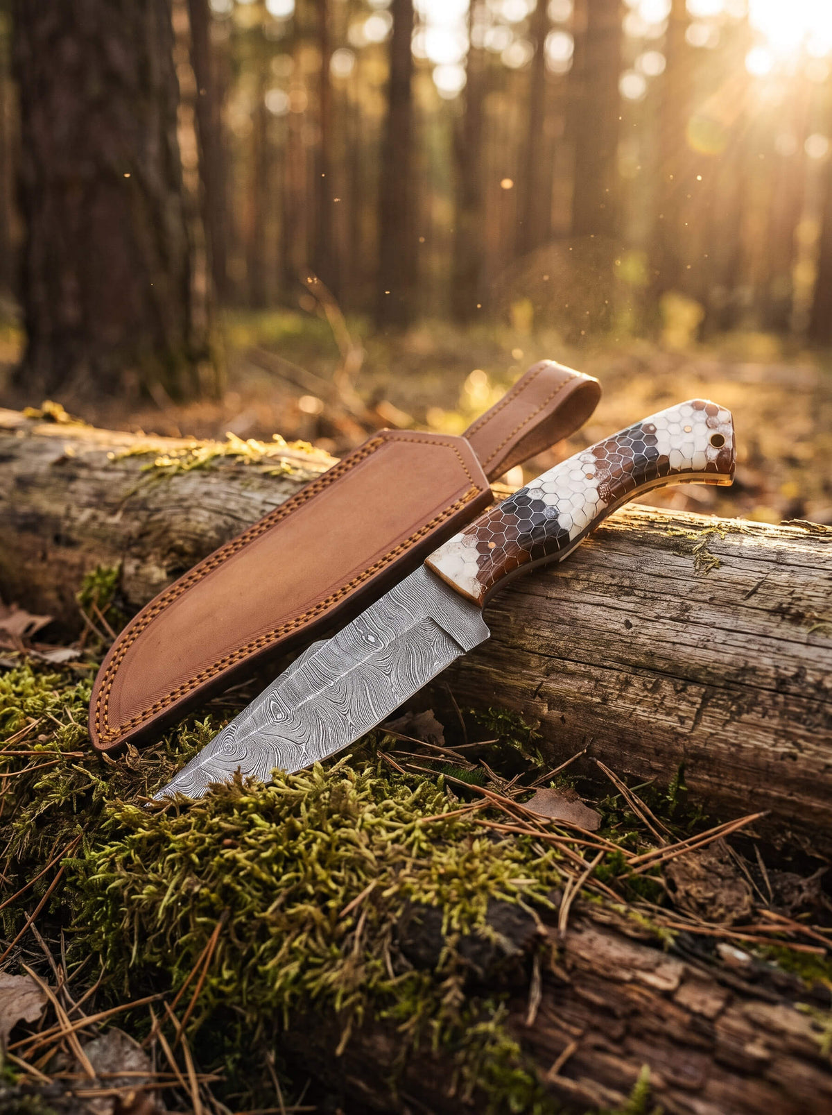 Damascus Viper Knife with patterned Damascus steel blade and leather sheath resting on a moss covered forest log Up To 75% Off Retail