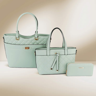 Three stylish pastel green bags including a tote, handbag, and wallet from the Luxe Trinity Bag Collection with quilted detailing and gold accents, Up To 75% Off Retail.