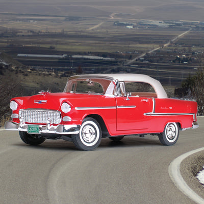 Red die cast 1955 Chevrolet Bel Air Convertible - Red model car displayed on a winding road with scenic background, unisex collectible, Up To 75% Off Retail.