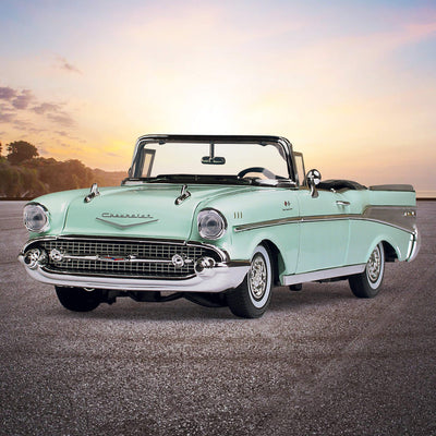 Classic 1957 Chevy Bel Air - Surf Green convertible displayed on a scenic open road at sunset, showcasing iconic chrome detailing and vintage style, Up To 75% Off Retail.