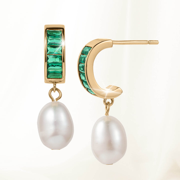 Pearl Radiance Earrings featuring gold-tone hoops with square-cut green gemstones and teardrop-shaped white pearls dangling below.