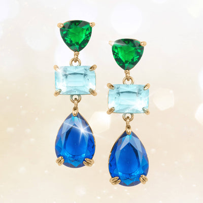 Elegant gold-plated earrings from the Midnight Riviera Collection featuring green, light blue, and deep blue gemstones, offering a captivating jewelry piece Up To 75% Off Retail.