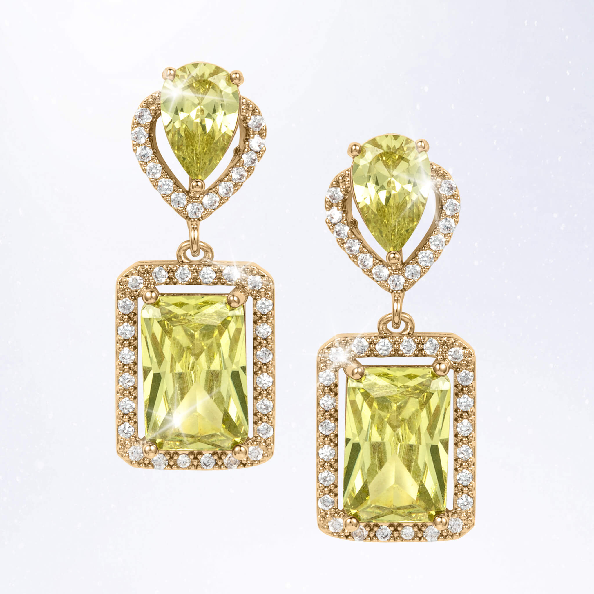 Gold tone drop earrings featuring faceted yellow green gemstones, rectangular pendant settings, and sparkling clear accent stones around the edges