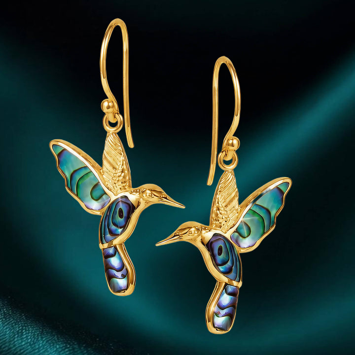 Elegant gold hummingbird earrings with iridescent abalone inlay, part of the Golden Abalone Hummingbird Collection, featuring vibrant jewelry design and up to 75% off retail.