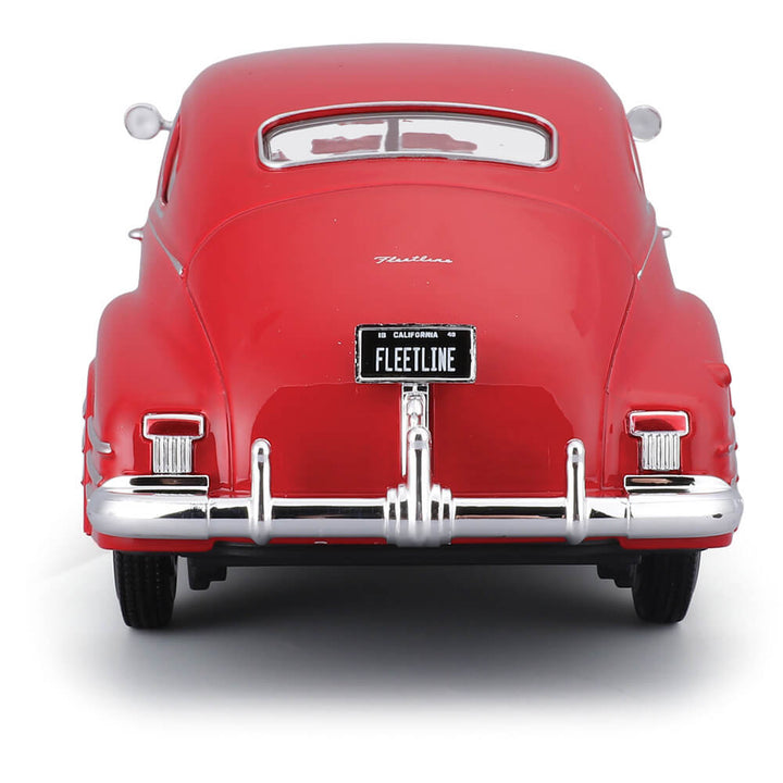 Rear view of a red die cast 1948 Chevrolet Fleetline Aerosedan model car with California license plate reading Fleetline, showcasing detailed chrome bumper and taillights, Up To 75% Off Retail.