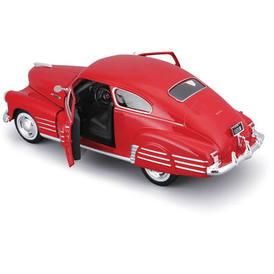 1948 Chevrolet Fleetline Aerosedan die cast model in red with open driver-side door, showcasing detailed interior, available Up To 75% Off Retail.