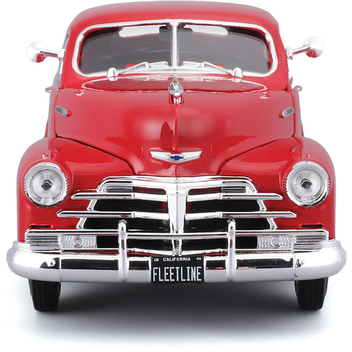 Front view of a die cast 1948 Chevrolet Fleetline Aerosedan model car in vibrant red with chrome detailing, offered Up To 75% Off Retail.