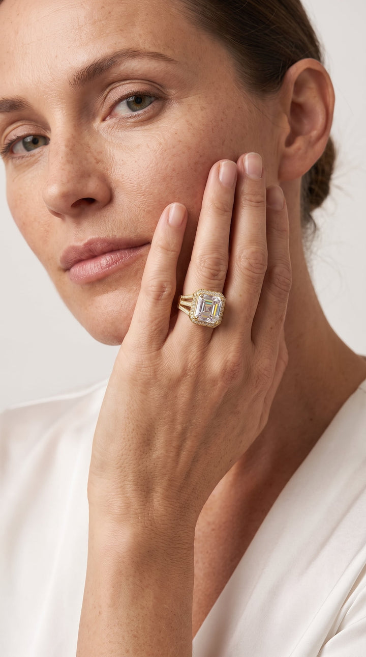 Woman wearing a large gold and diamond Solace Sparkle Ring on her finger, showcasing jewelry elegance with a tagline Up To 75% Off Retail.