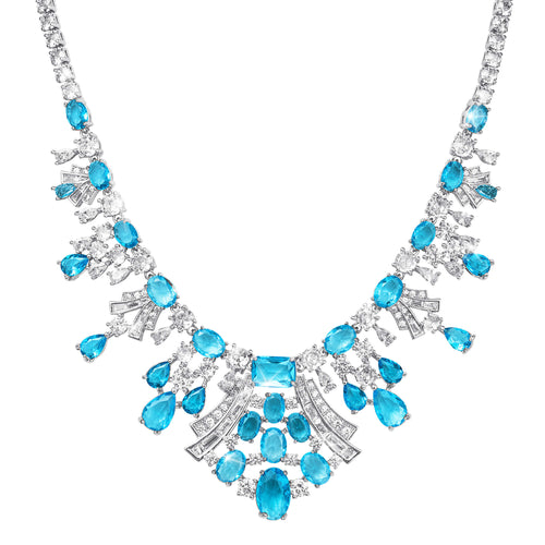 Elegant necklace with blue gemstones and silver accents on a white background