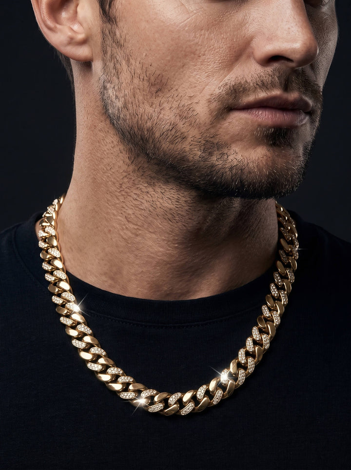 Magnus Necklace featuring a bold gold Cuban link chain styled on a man in a black shirt with polished links catching the light