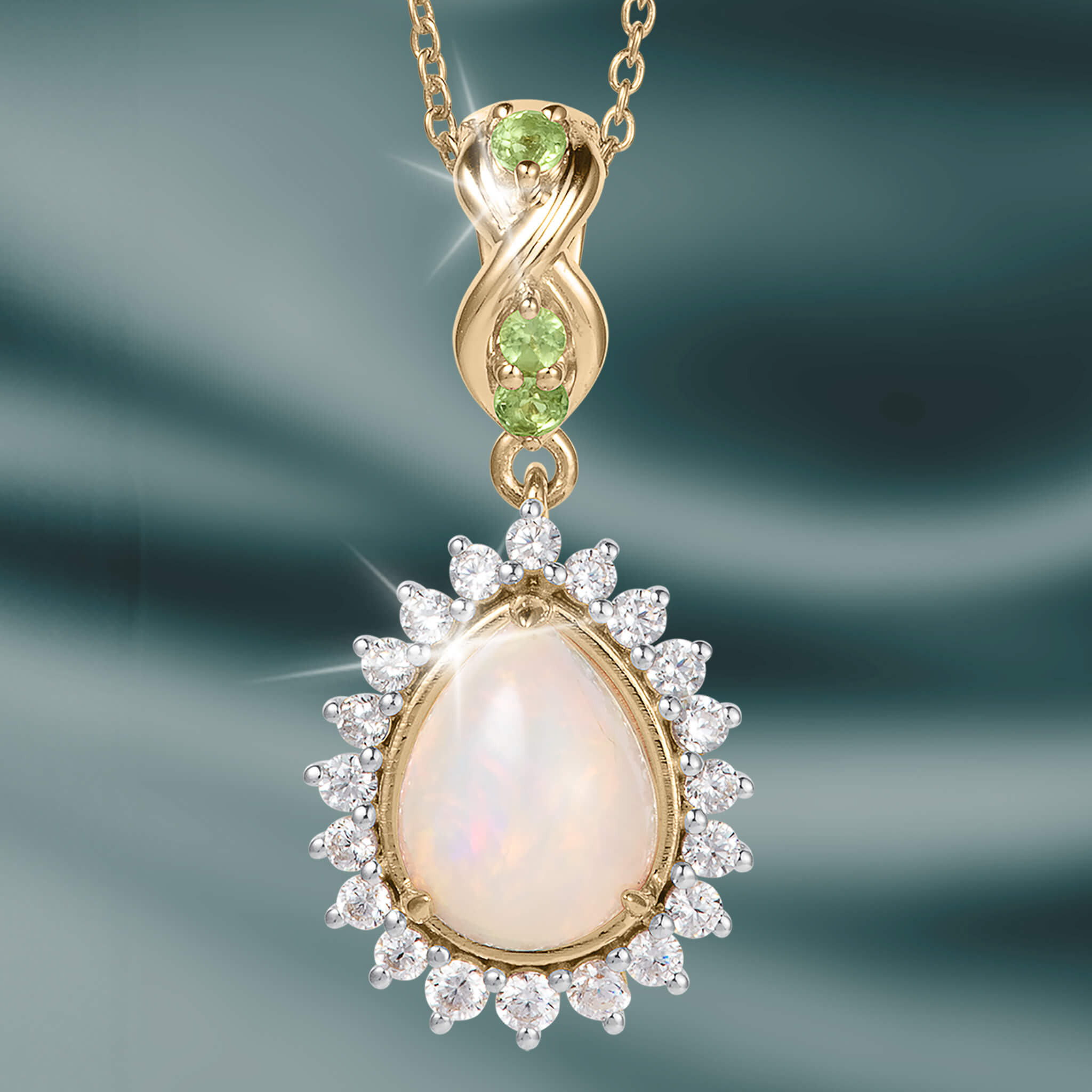 Opal Dew Drop Pendant featuring a luminous teardrop opal with sparkling clear stones and green gemstone accents on a gold tone chain Up To 75% Off Retail