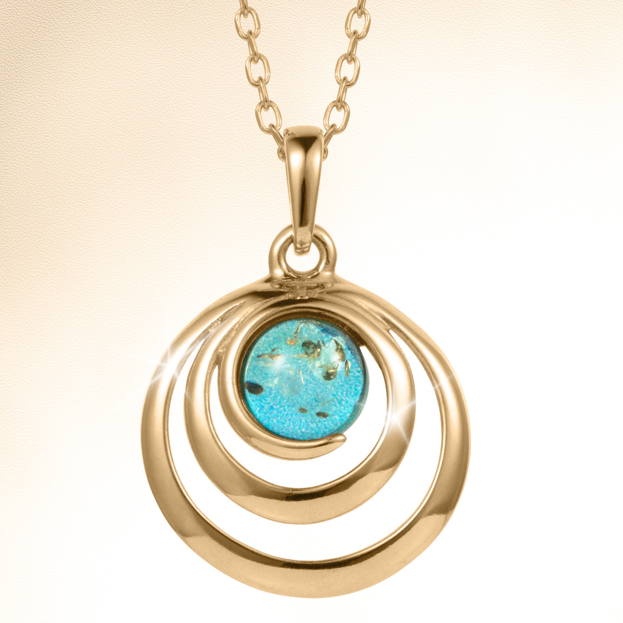 Baltic Lagoon Pendant featuring a polished gold tone spiral design with a vivid turquoise center stone on a linked chain Up To 75% Off Retail