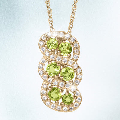 Elegant gold pendant necklace from the Elysian Peridot Collection featuring vibrant peridot gemstones and sparkling accents, available Up To 75% Off Retail.