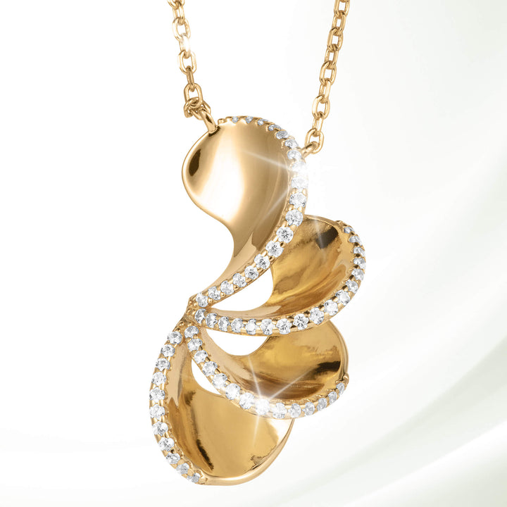 Elegant gold pendant necklace from the Arianna Collection featuring a flowing design accented with sparkling crystals, available Up To 75% Off Retail.