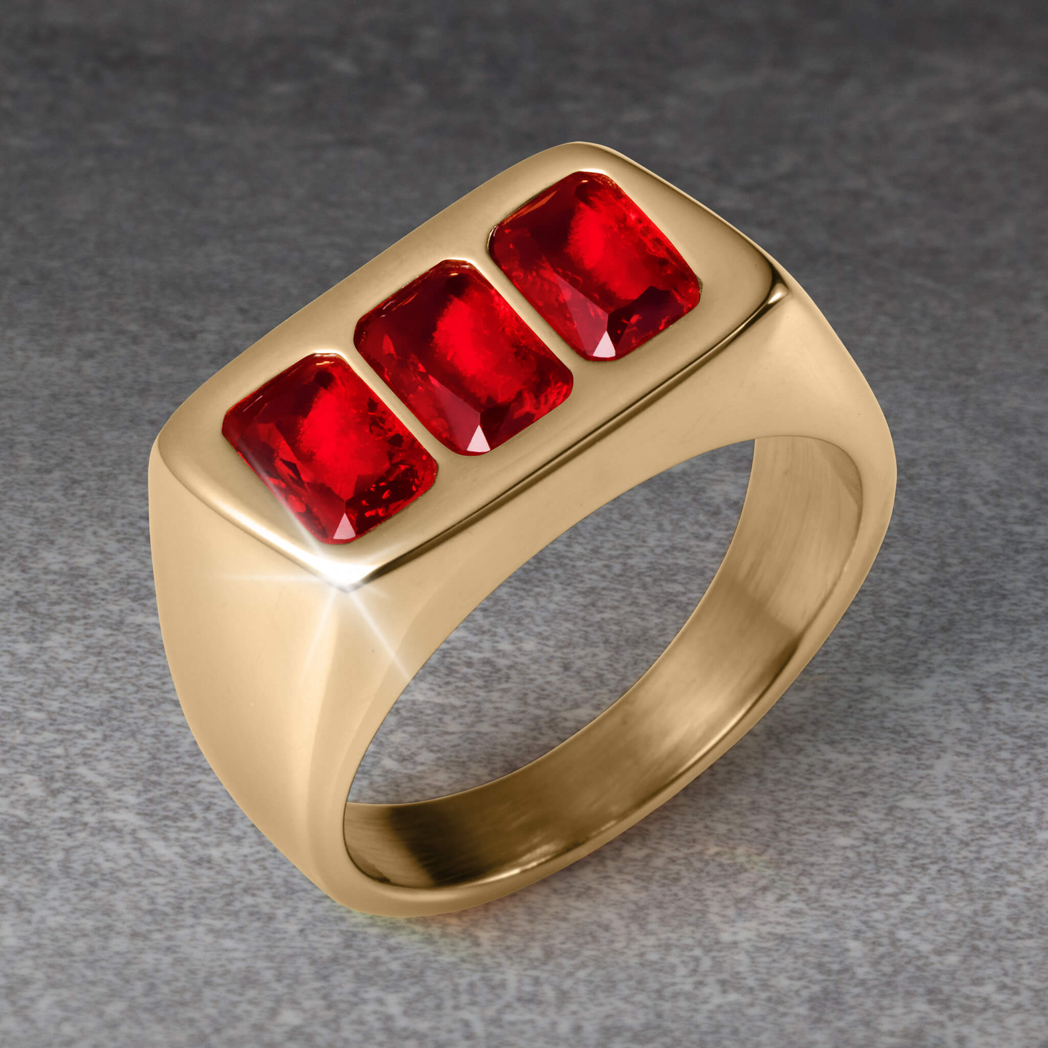 Gold men's ring featuring three rectangular red gemstones, showcasing bold design from the Sangre Men's Collection, available Up To 75% Off Retail.